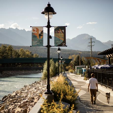 Stroll by the Kicking Horse river on the downtown River Walk