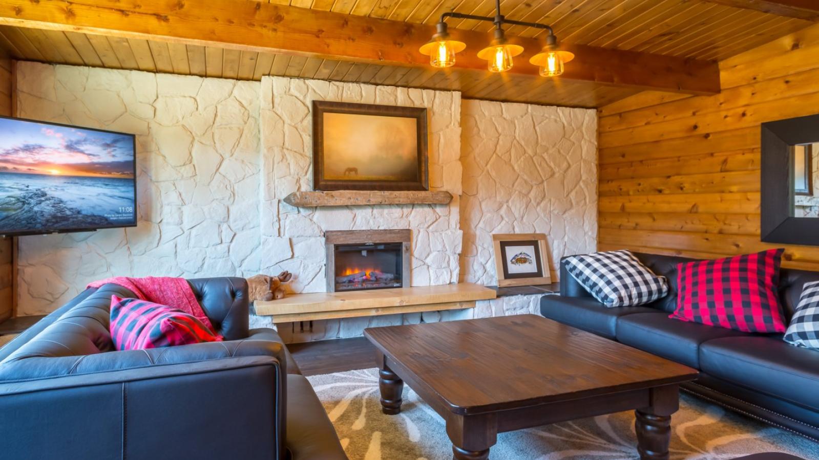 Lounge area with fireplace and television