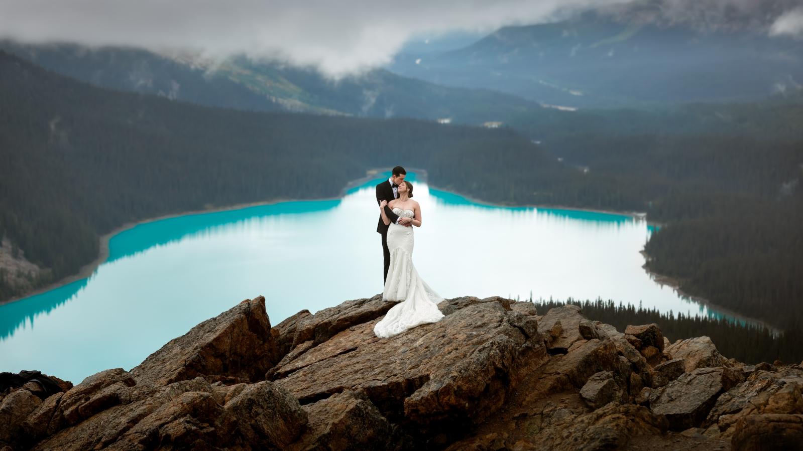 Wedding photo in the mountains, lake in background