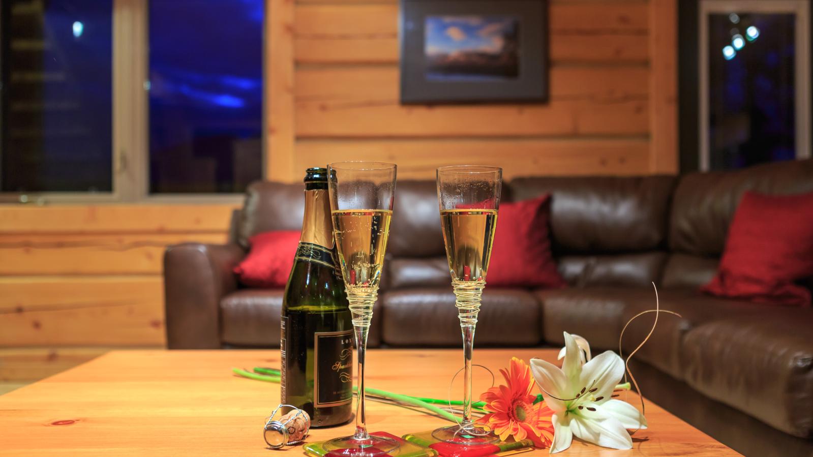 Champagne and flowers laid out on the table