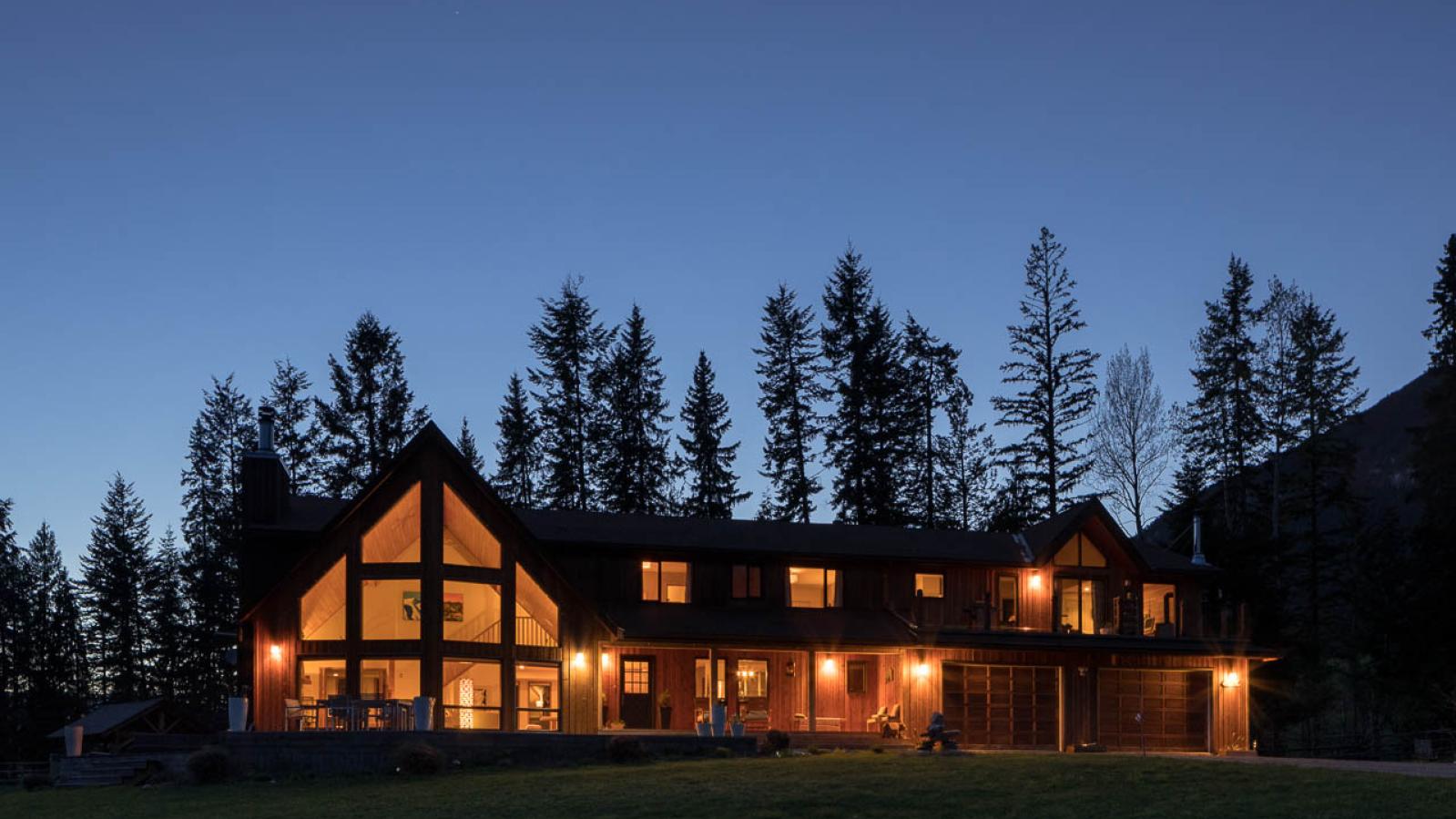 Exterior view of Home Lodge Golden BC at night.